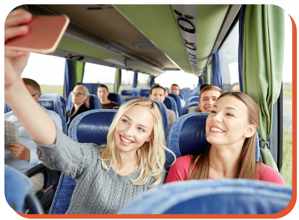 girls taking a selfie on a bus-01